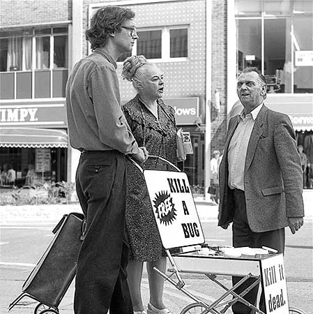 Black and white photo of Ms. Piddington telling the man he is cruel while yelling for the police